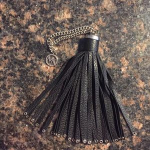 Michael Kors black “Brooklyn” grommet tassel